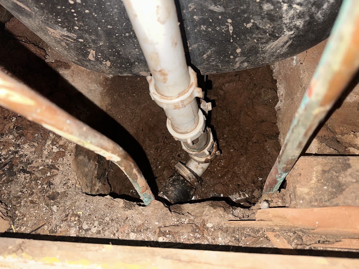 Plumbing repair in a crawlspace under a home